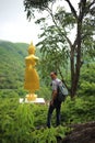 Man and Buddha statue at Pratad Inkwan pagoda