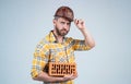man build house. mature builder in shirt. unshaven man on construction site. handsome building worker in hard hat. labor Royalty Free Stock Photo