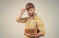 man build house. mature builder in shirt. unshaven man on construction site. handsome building worker in hard hat. labor Royalty Free Stock Photo