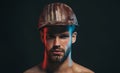 Man builder. Closeup portrait of serious male architect, contractor or engineer in safety hardhat. Handsome construction Royalty Free Stock Photo