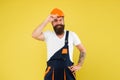 Man builder hard hat. Creativity and practice. Improvement and renovation. Brutal man builder. Bearded guy worker on Royalty Free Stock Photo