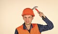 man builder use hammer. professional repairman in helmet. build and construction. skilled architect repair and fix