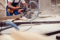 Man builder using wood cutting circular saw machine Royalty Free Stock Photo
