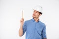 Man building engeneer in hard hat pointing up with pencil