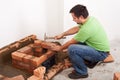 Man building fireplace Royalty Free Stock Photo