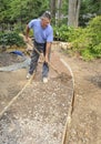 Man building gravel path