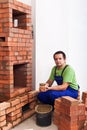 Man building a masonry heater Royalty Free Stock Photo