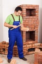 Man building masonry heater Royalty Free Stock Photo