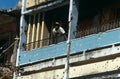 A man in a bullet riddled building in Angola