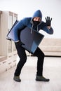 The man burglar stealing tv set from house Royalty Free Stock Photo