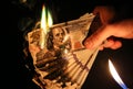 Man is burning money. Dollars photo. Greedy corruption concept. Bribe idea. Inflation rates. Price growth