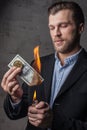 Man burning one hundred dollar note Royalty Free Stock Photo