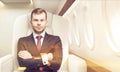 Man in business class of a plane, toned Royalty Free Stock Photo