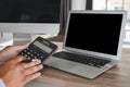 Man of business man hand working on laptop computer on wooden desk Laptop with blank screen on table Royalty Free Stock Photo