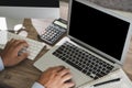 Man of business man hand working on laptop computer on wooden desk Laptop with blank screen on table Royalty Free Stock Photo