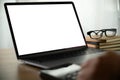 Man of business man hand working on laptop computer on wooden desk Laptop with blank screen laptop  on table Royalty Free Stock Photo