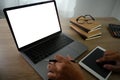 Man of business man hand working on laptop computer on wooden desk Laptop with blank screen laptop  on table Royalty Free Stock Photo