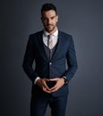 The man on a business mission. Studio shot of a stylish and confident young businessman posing against a gray background Royalty Free Stock Photo