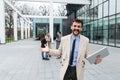 Man business person CEO, leader and strong independent worker portrait outside office building. Male leadership in company,