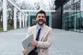 Man business person CEO, leader and strong independent worker portrait outside office building. Male leadership in company,