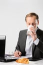 Man in business suit has caffeine coffee fix