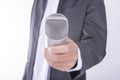 Man in business suit holding microphone - interview concept Royalty Free Stock Photo