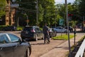 a man in a business suit rides a bicycle. He is late for work. Standing at a traffic light Royalty Free Stock Photo