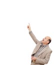 man in business suit shows his index finger up, drawing attention Royalty Free Stock Photo