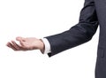 Man in business suit shows outstretched hand with open palm.