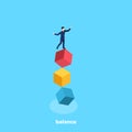 A man in a business suit is standing on cubes trying to keep balance Royalty Free Stock Photo