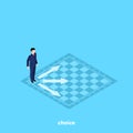 A man in a business suit stands on a chessboard and decides which one to make a move
