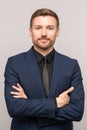 Man in business suit on studio gray background. Manager, director of company, successful businessman