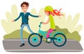 Man in business suit teaches daughter to ride bike. Female character in helmet rides bicycle