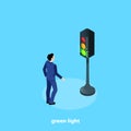 A man in a business suit and a traffic light with a burning green light Royalty Free Stock Photo