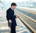 Man on business trip using his smartphone Royalty Free Stock Photo