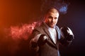 Man businessman in gray suit and boxing gloves Royalty Free Stock Photo