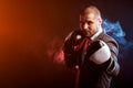 Man businessman in gray suit and boxing gloves Royalty Free Stock Photo