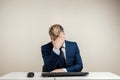 Man businessman tired at the computer, office worker in a tired state. The concept of the village of botoreyka, fatigue,