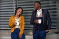 Man and businesswoman having coffee outdoors Royalty Free Stock Photo