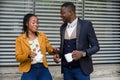 Man and businesswoman having coffee outdoors Royalty Free Stock Photo