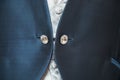 Man buttoning on a blue jacket. Wedding details - elegant groom dressed wedding tuxedo costume is waiting for the bride Royalty Free Stock Photo