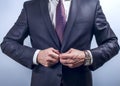 Man buttoning dark jacket Royalty Free Stock Photo