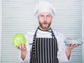 Man buy cabbage for dollars. mature man love organic healthy food. Money business. professional chef cook in restaurant Royalty Free Stock Photo