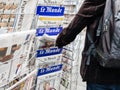 Man buyin Le monde press newspaper kiosk paris