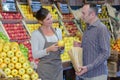 Man buying apples in greengrocers Royalty Free Stock Photo