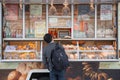 Man buying food at bread shop
