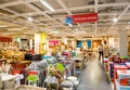 Man buying furniture inside large retail store