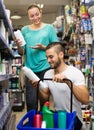 Man buying shampoo Royalty Free Stock Photo