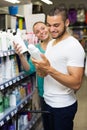 Man buying shampoo Royalty Free Stock Photo