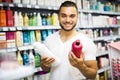 Man buying shampoo Royalty Free Stock Photo